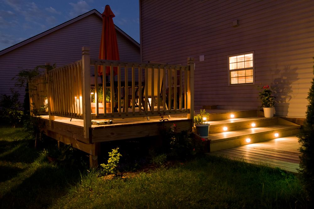Wood deck at dusk with integrated stair and post lighting