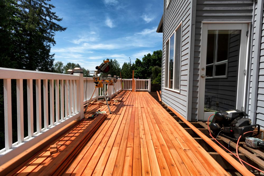 Custom deck staircase with wood railing